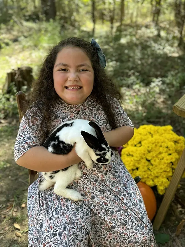 Girl holding a rabbit